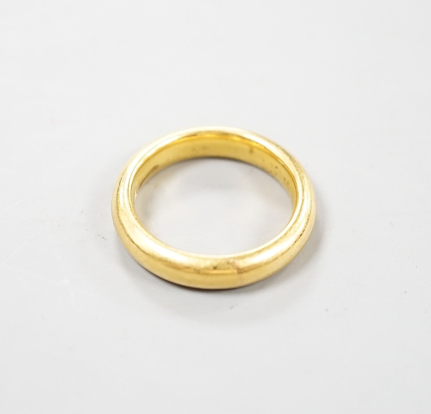 A 22ct gold wedding band, size K/L, 8.3 grams.